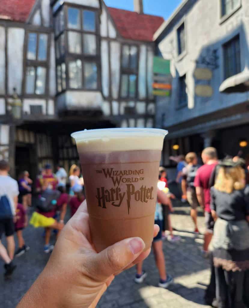 Enjoying a butterbeer at the Wizarding World of Harry Potter.